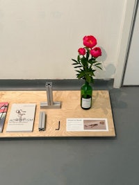 a table with a vase and books on it